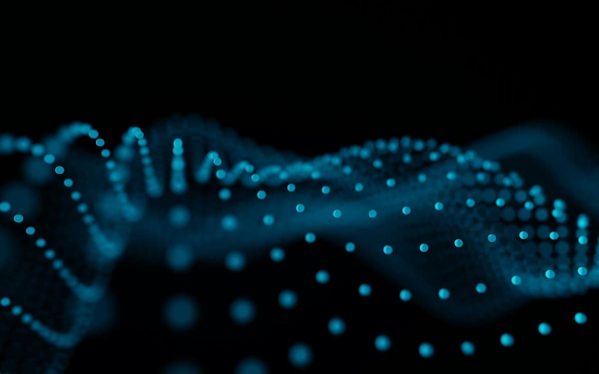 Blue points of light flowing in waves
